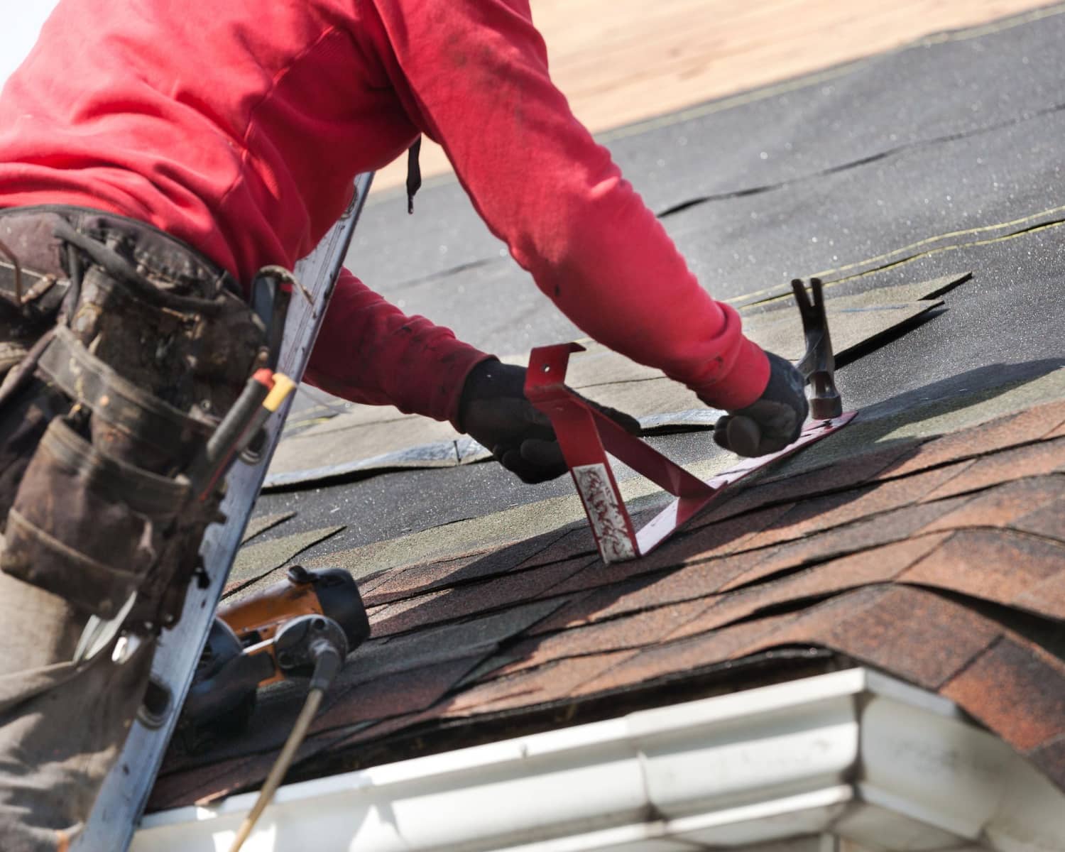 Contractor replacing a roof