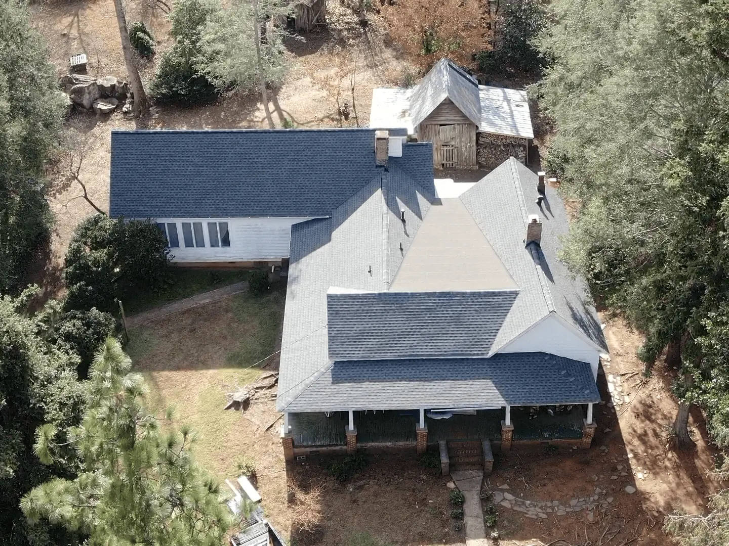 Legacy Roofing technician repairing a shingle roof in Lawrenceville, GA