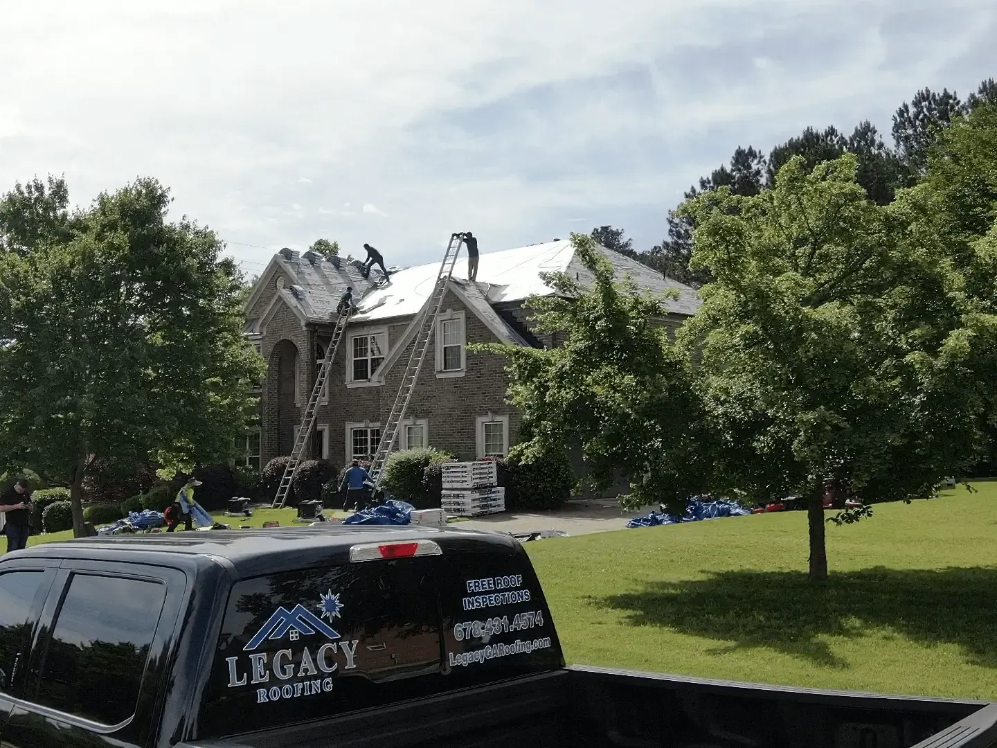 Legacy Roofing crew completing a roof replacement in Greater Atlanta